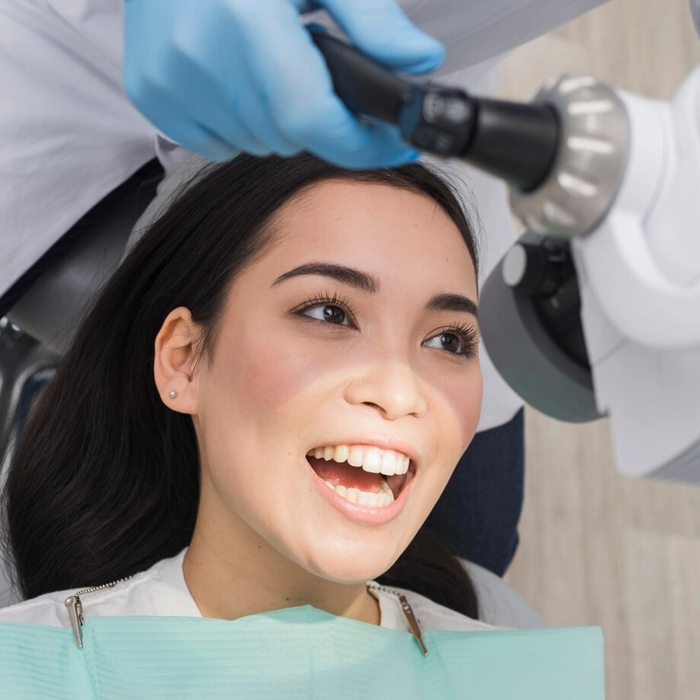 Dental team helping patient without insurance